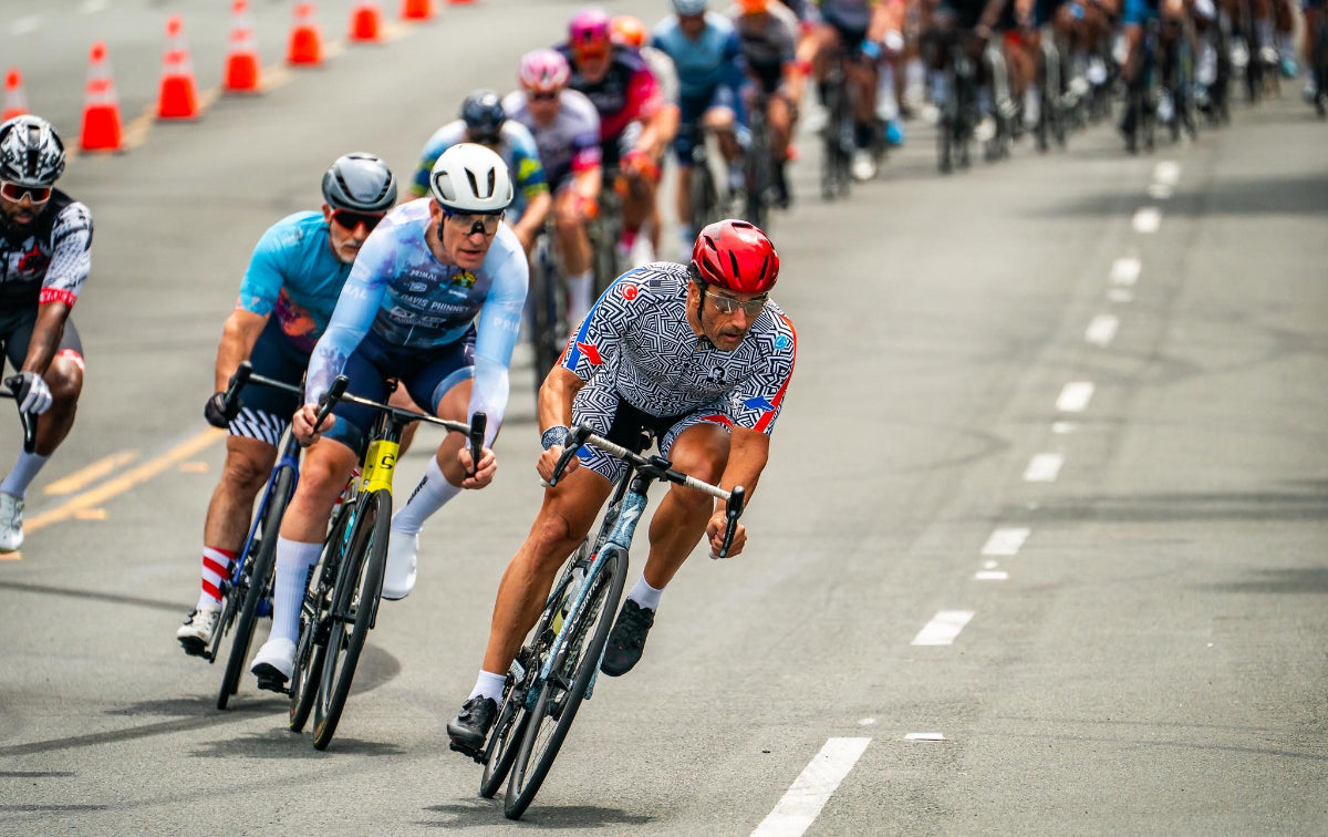 Cycling race with multiple riders on a road track